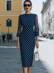 Elegantní tmavě modré puntíkaté midi šaty se síťovanými rukávy