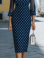 Elegantní tmavě modré puntíkaté midi šaty se síťovanými rukávy