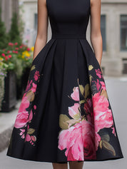 Elegantní midi šaty bez rukávů s květinovým vzorem na sukni